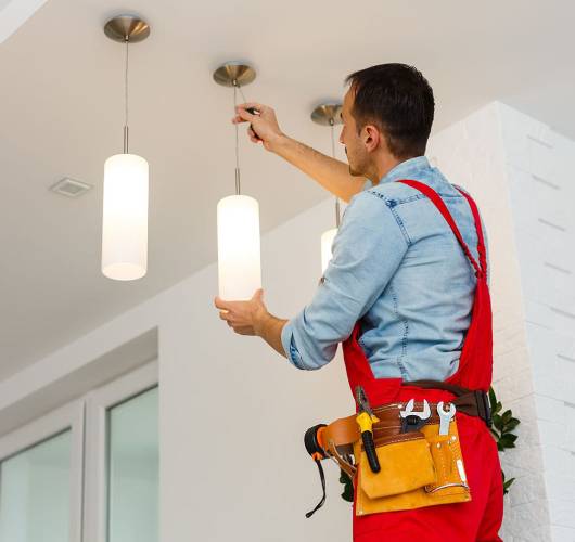 One of our handyman in orchard installing lights in a home