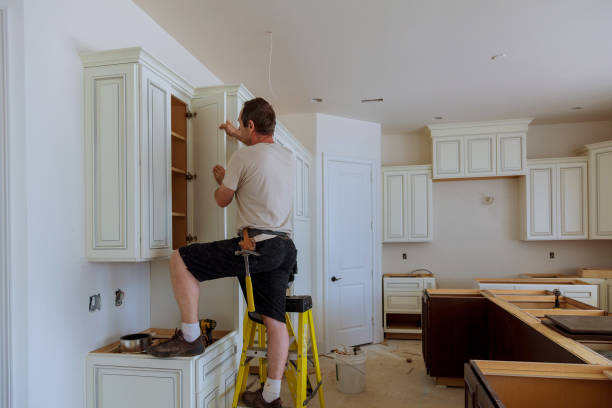 a handyperson checking cabintes faults