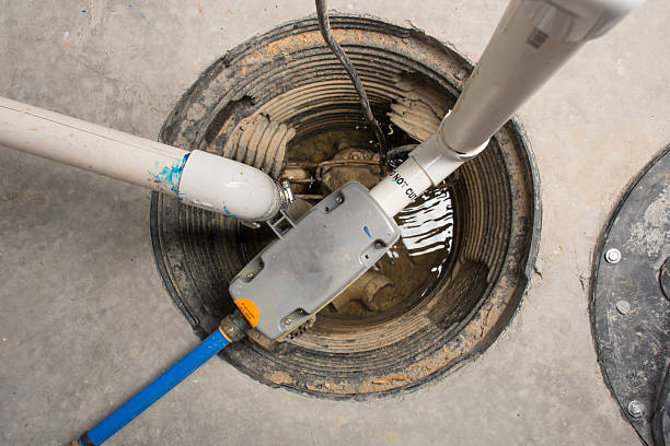 A sump pump installed in a basement of a home with a water powered backup system.