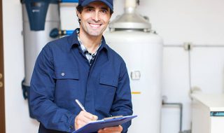 Technician servicing an hot-water heater